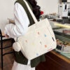 Embroidery in beige with