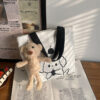 White + teddy bear pendant.