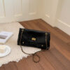 Black gold handbag