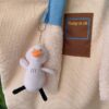 Beige with duck pendant