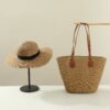 Khaki bag + wide-brimmed hat